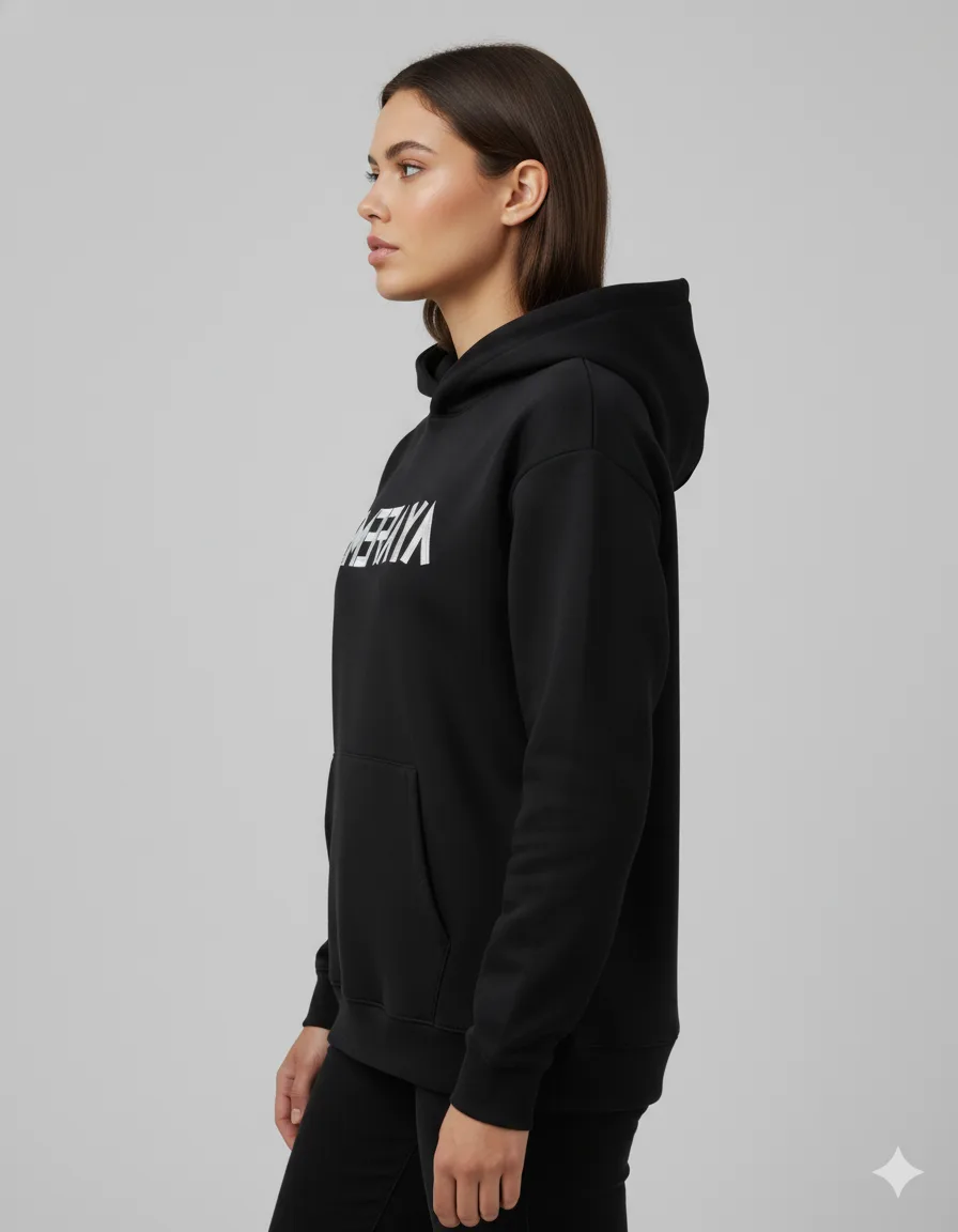 Woman in black hoodie in side profile